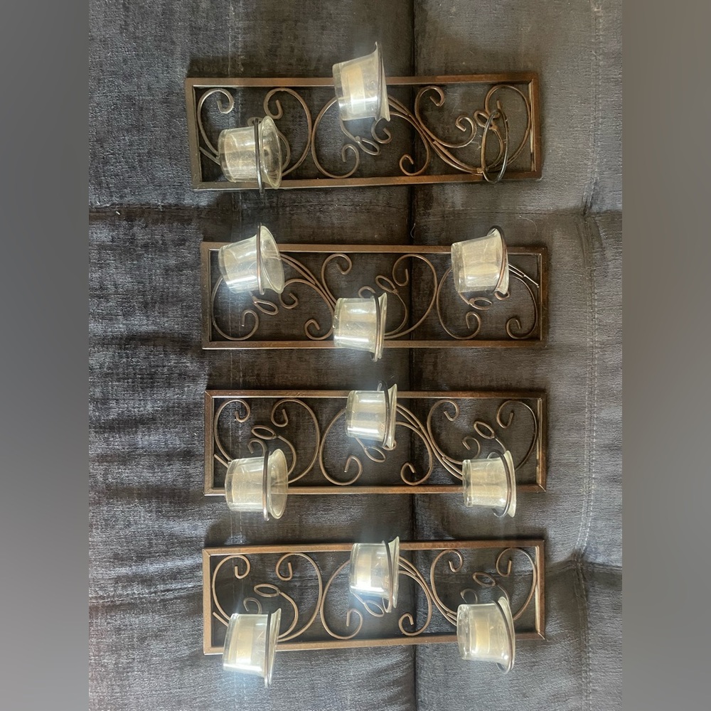 I have four candle wall holders. One is missing one candle glass.